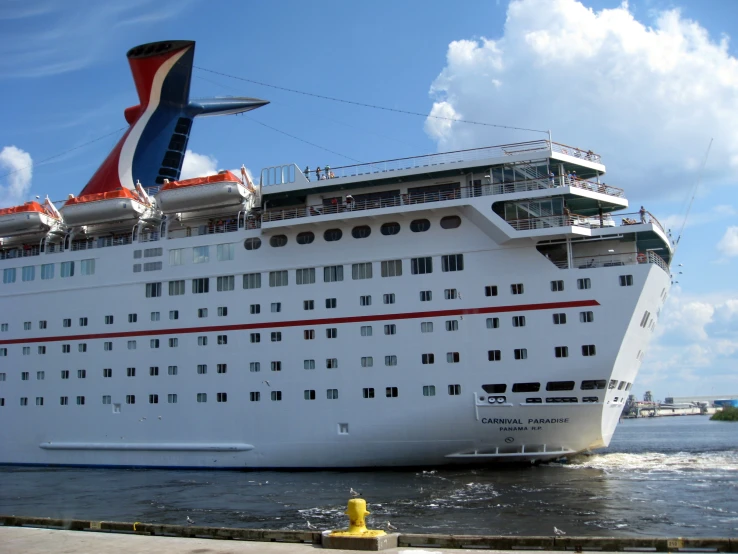 the large cruise ship has a multicolored tail