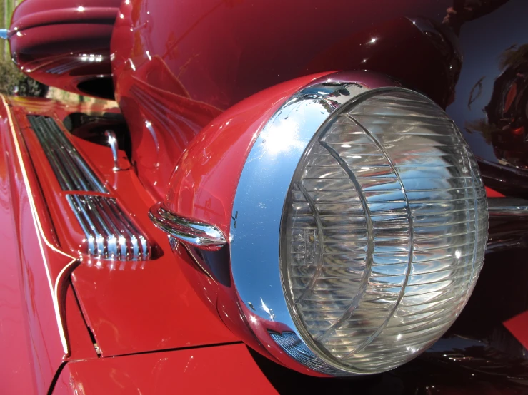 a close up of the headlights of an antique car