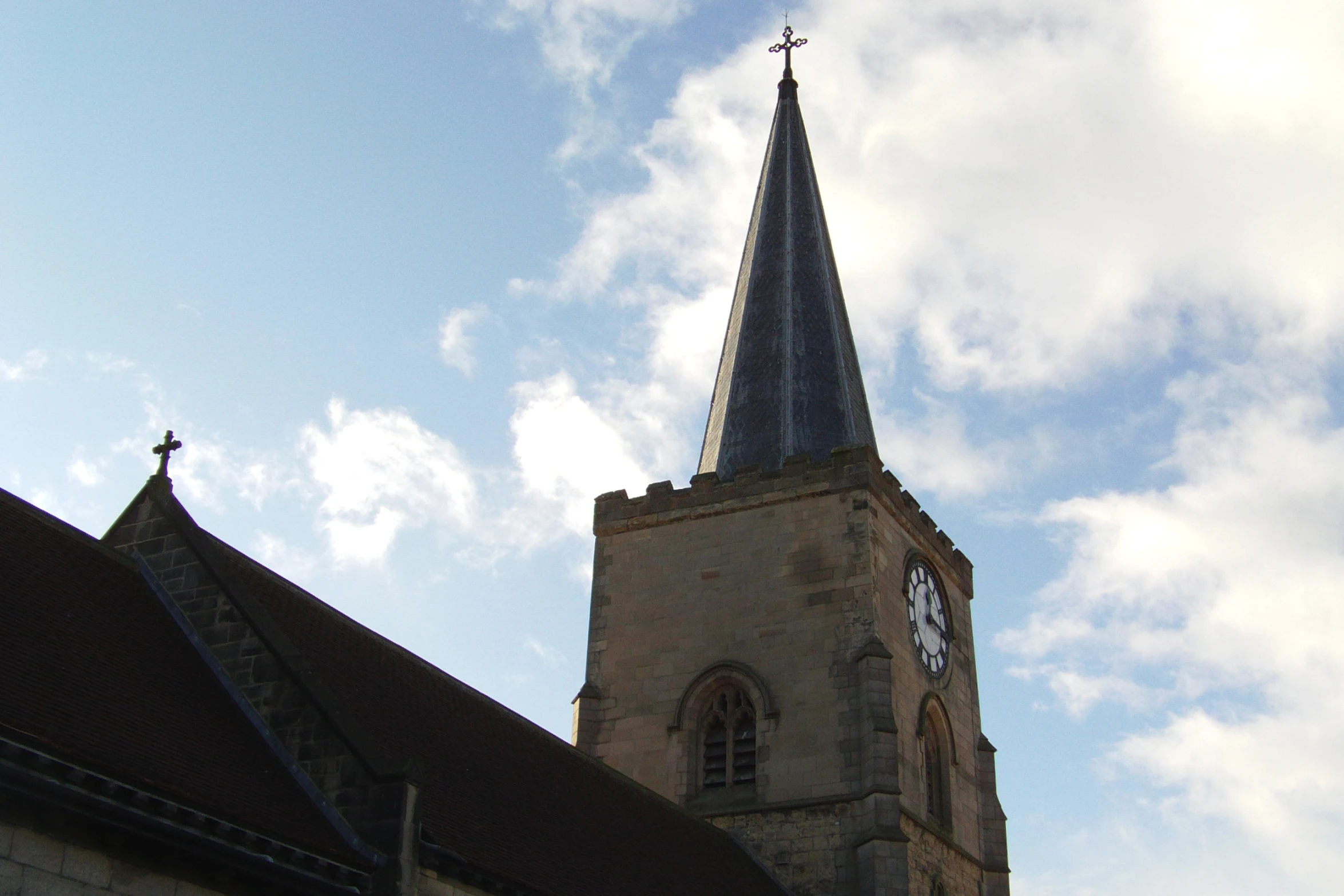 an old church steeple stands tall in the sky