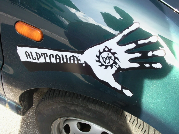 a close up view of a car with the hand with an arm