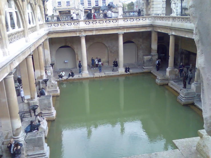 a building with an indoor pond in it