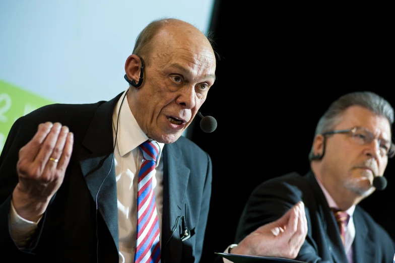 a couple of men sitting at a table