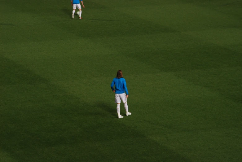 two male soccer players are on the field