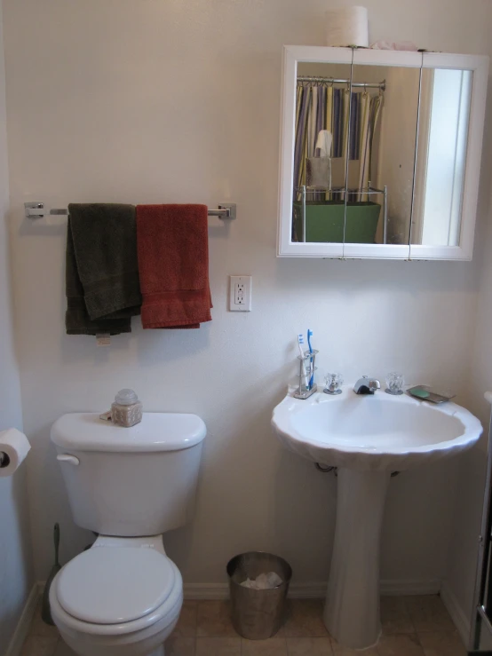 an image of a bathroom setting with toilet and sink