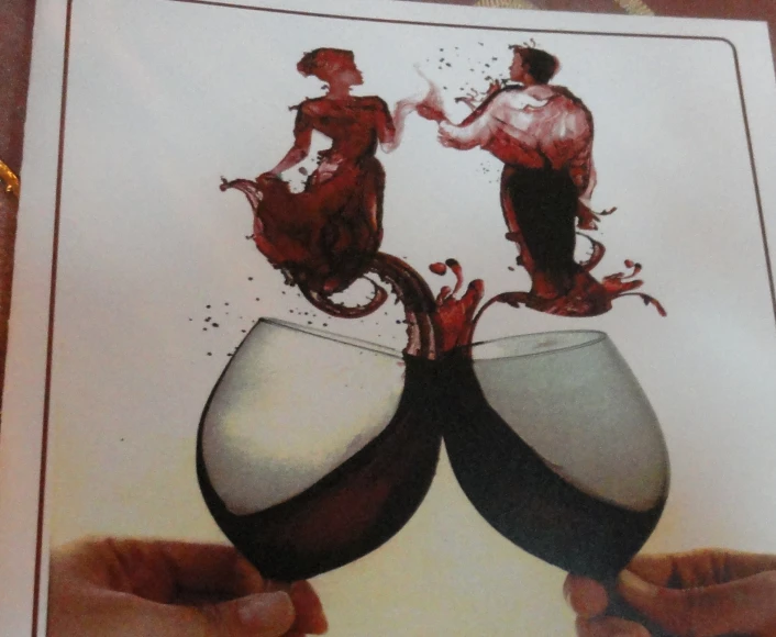 two hands holding two wine glasses next to each other