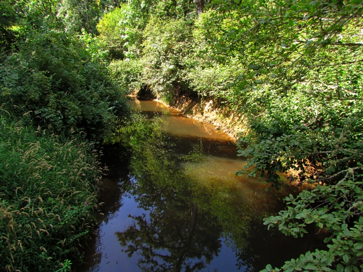 a river with small boats sitting on the water