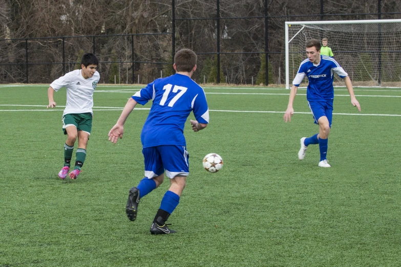 a couple of young men playing a game of soccer