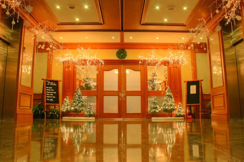 two tall wood doors are shown in an office building