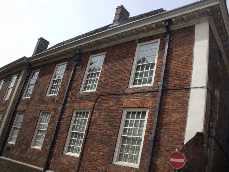 a red brick building with several windows on each floor