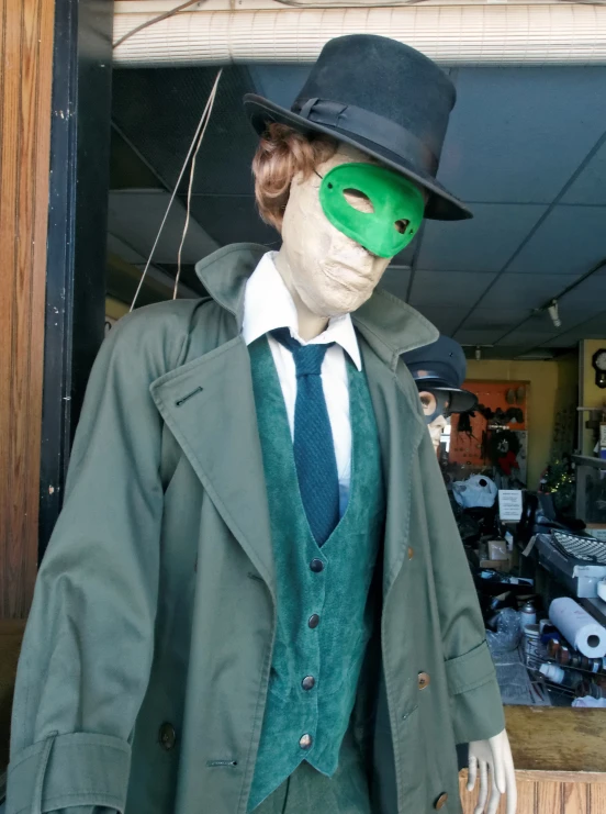 the dummy is dressed in a green suit