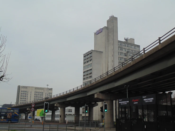 a city bus is passing through a green light