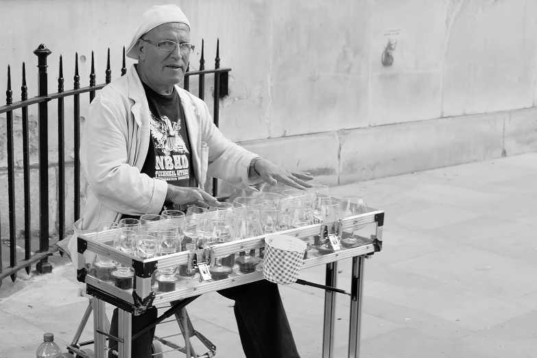 a man sitting on top of an electronic table filled with drinks