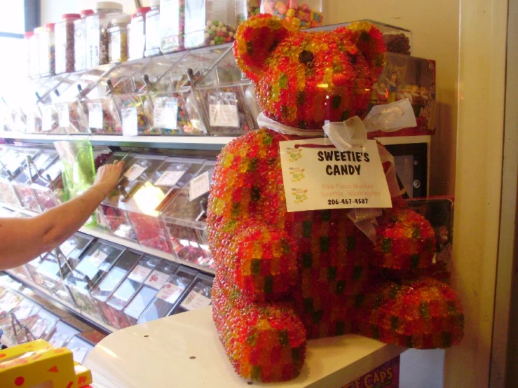 a teddy bear made out of fake flowers