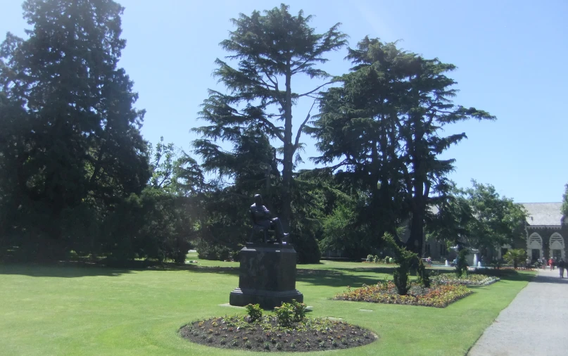 a sculpture sits in the middle of a park