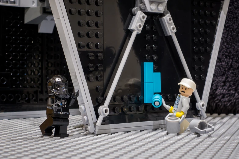 star wars figures posed in front of a lego bridge