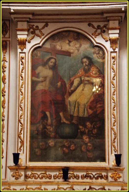 an ornate painting of jesus carrying the cross in a church