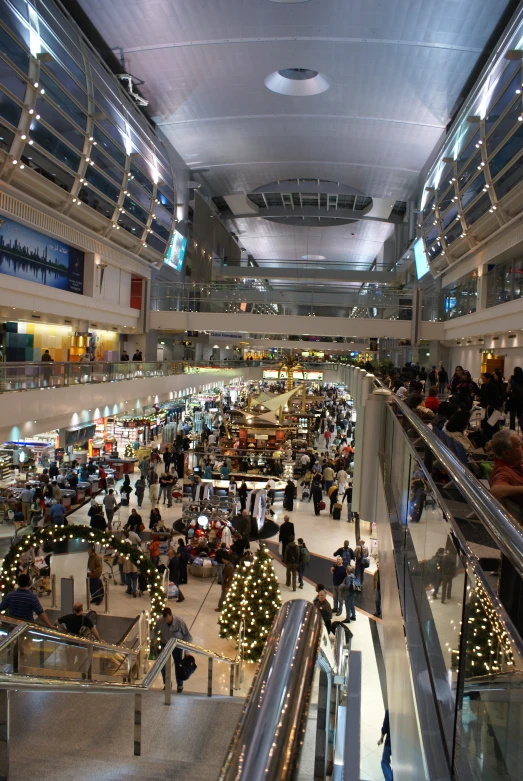 a crowd of people with many different luggage