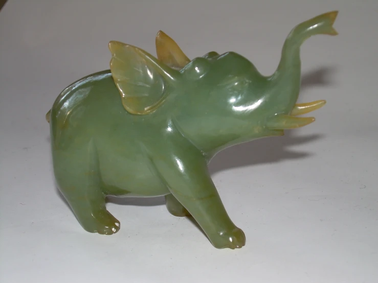 an elephant figurine sitting on top of a counter