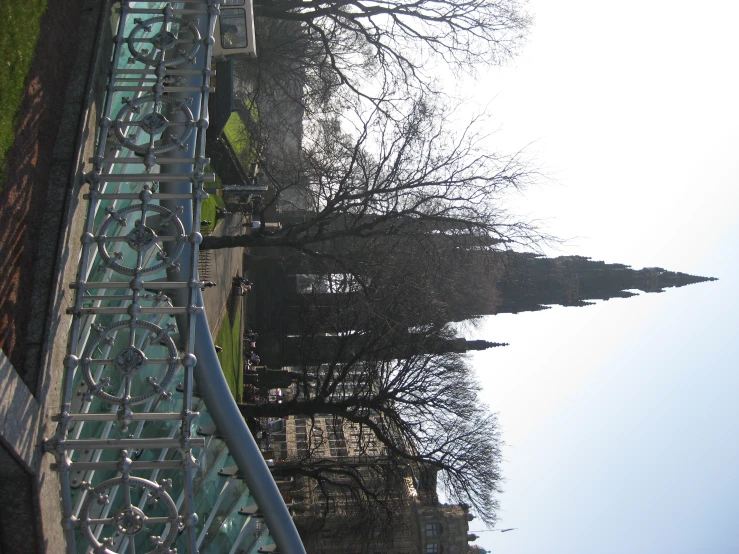 a bike bridge with railings near some old buildings