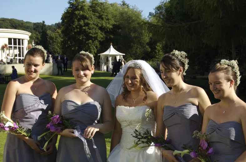 bride with her friends outside for a wedding