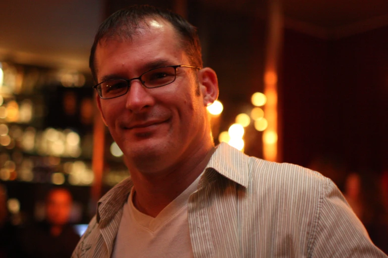 a man standing in front of blurry lights