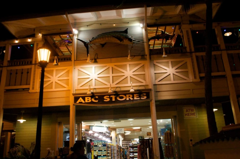 a night s of the entrance to an abc stores store