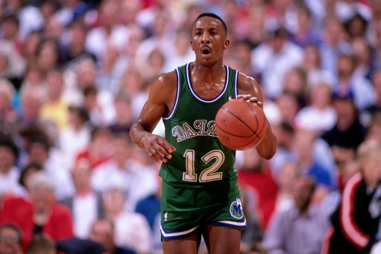 a basketball player with the ball in his hand