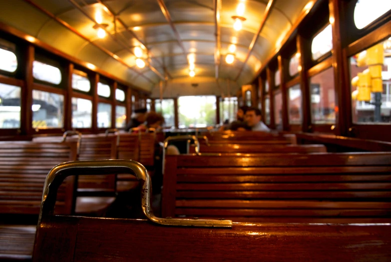 the inside of a train with empty seats