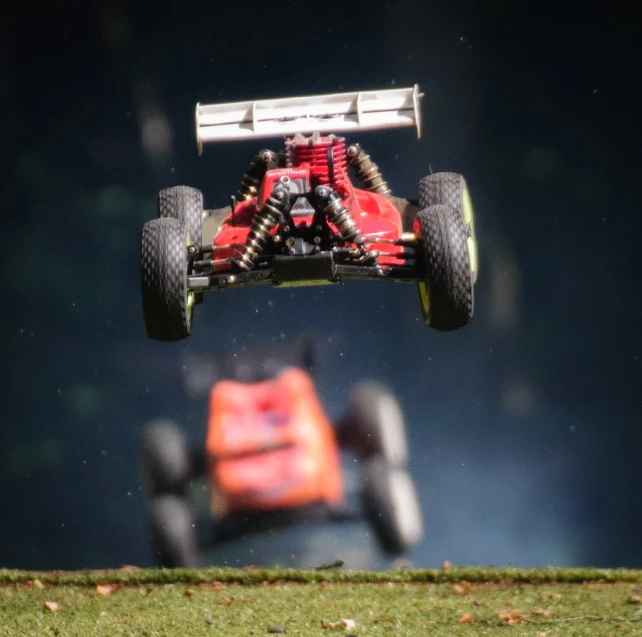 a car that is in the air over grass