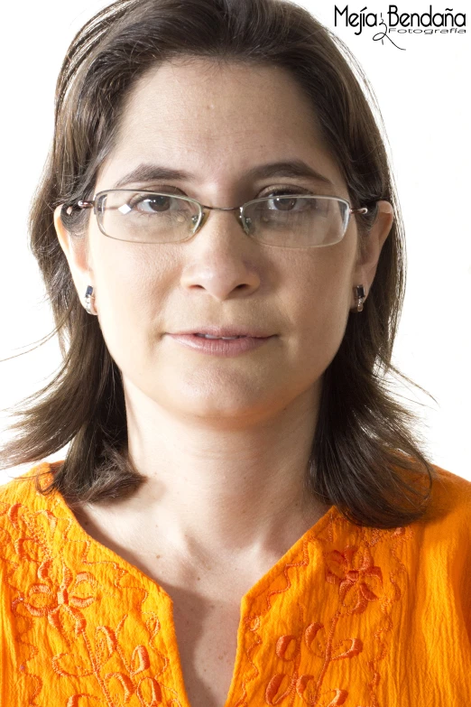 a woman with glasses looking into the distance