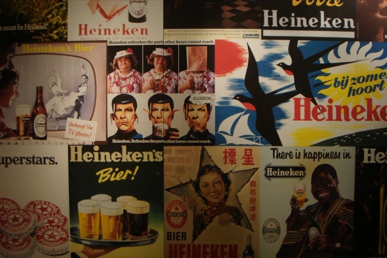 many beer posters have been stacked together