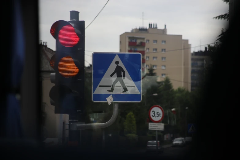 a sign on a pole reads walk traffic is down