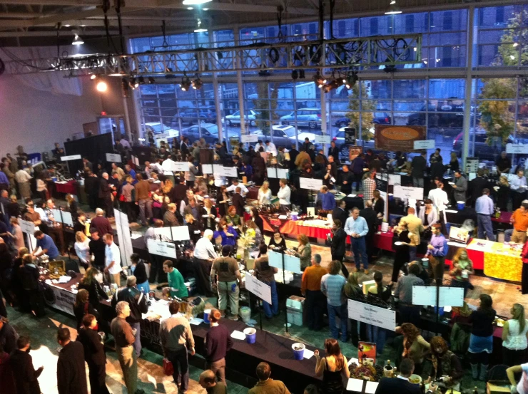 large group of people standing around holding signs