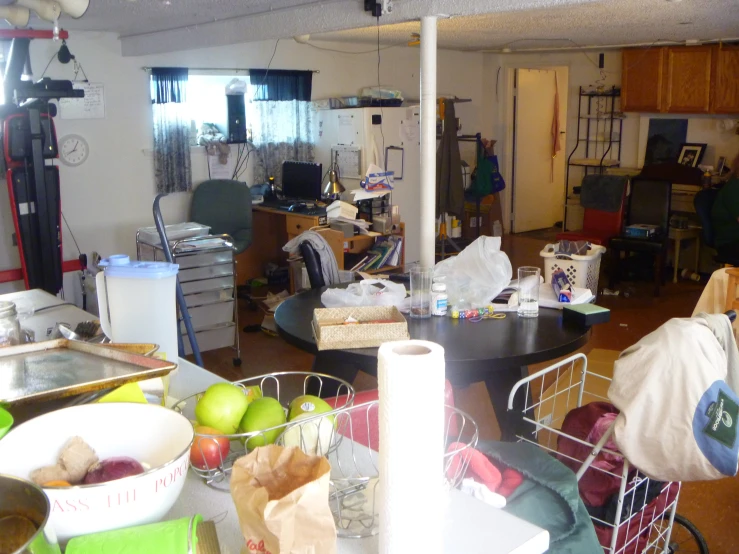 a kitchen filled with lots of clutter and garbage