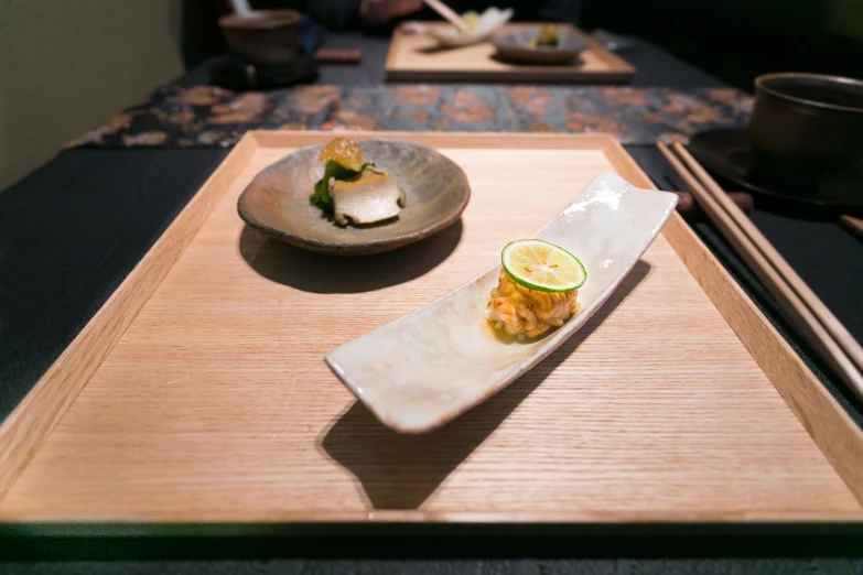 a white plate topped with food on top of a wooden table