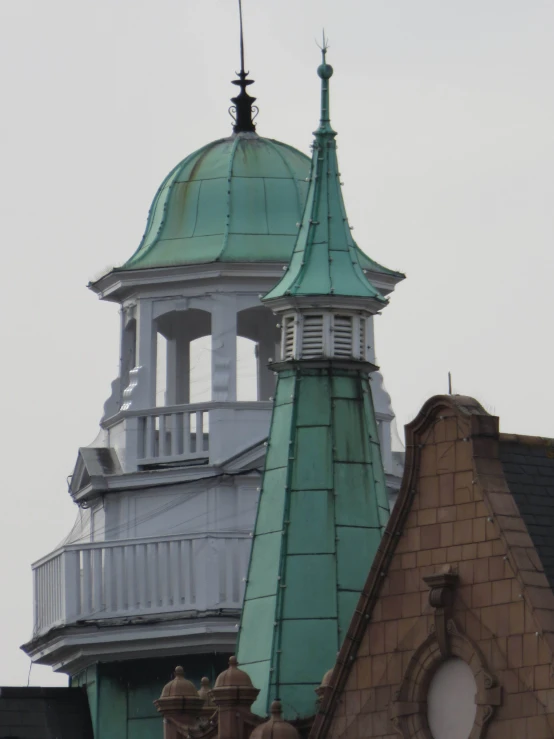 the top of a building with a tower with a clock