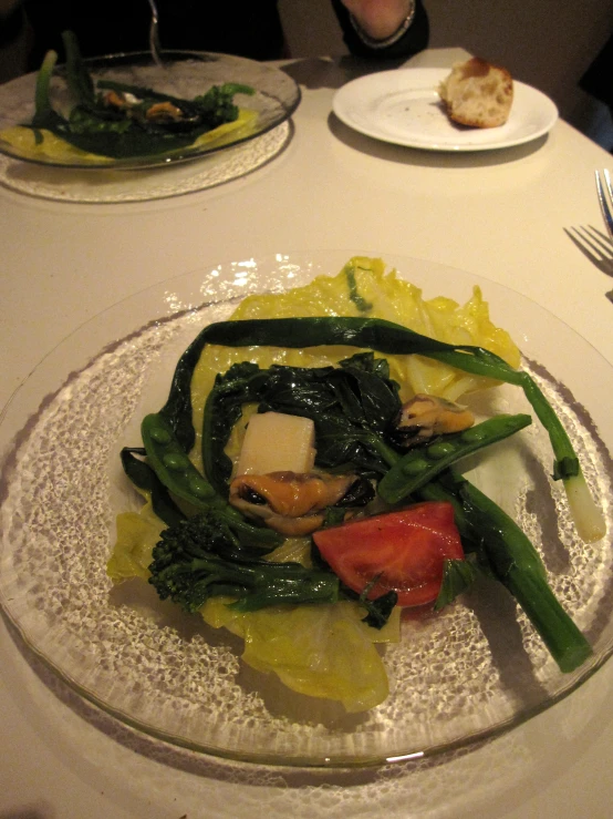 a white table topped with plates filled with food