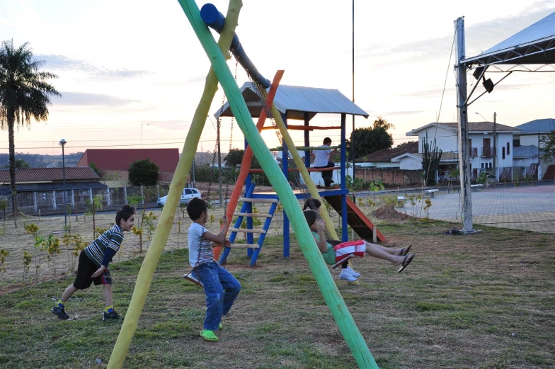 s playing in a colorful playground area during the day