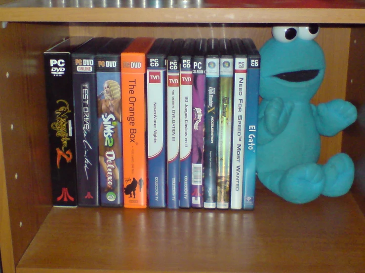 sesame book shelf holding several dvds for each character