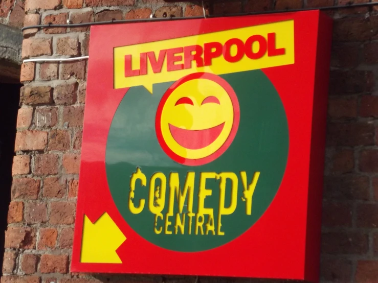 a sign for the liverpool comedy central, outside a building