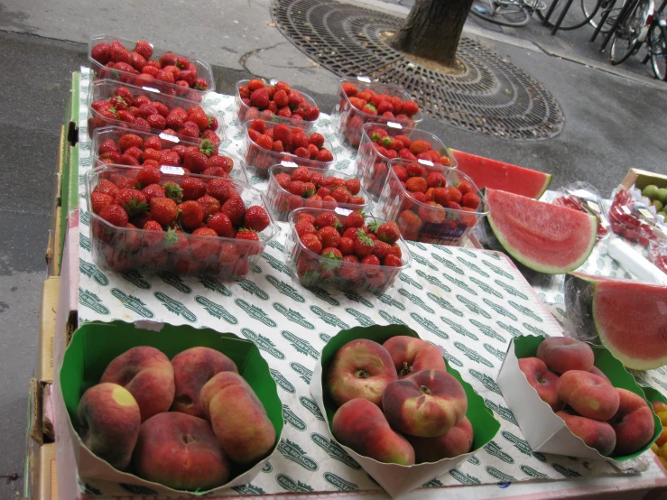 many different fruits and vegetables are set out for sale