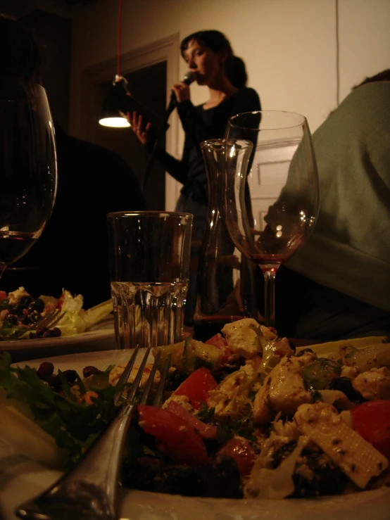 a table is set with silverware, glasses and food