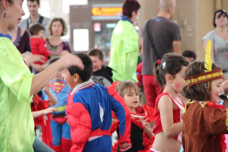 young children dressed in costume dancing at an event