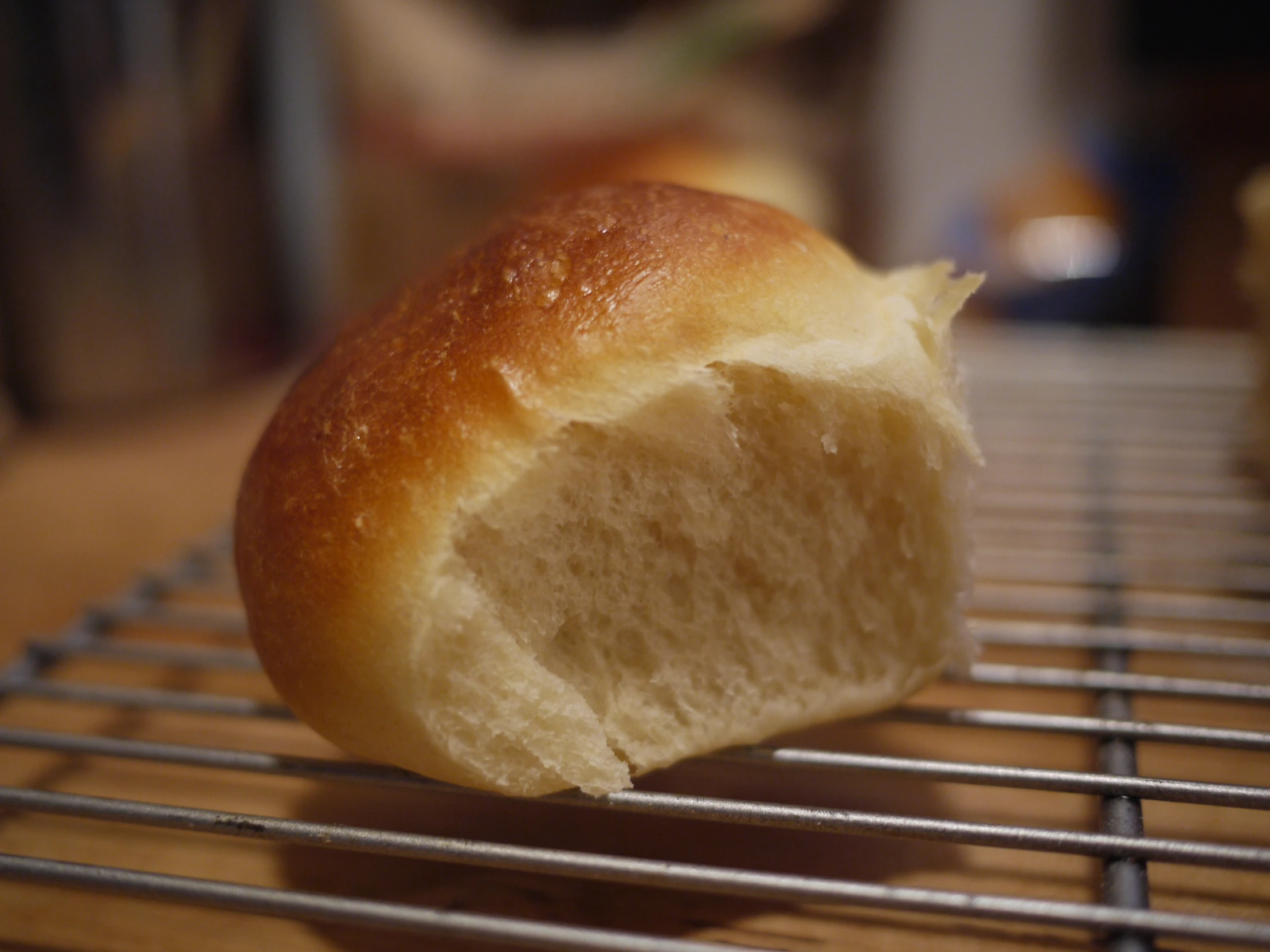 a single slice of bread sitting on a metal rack