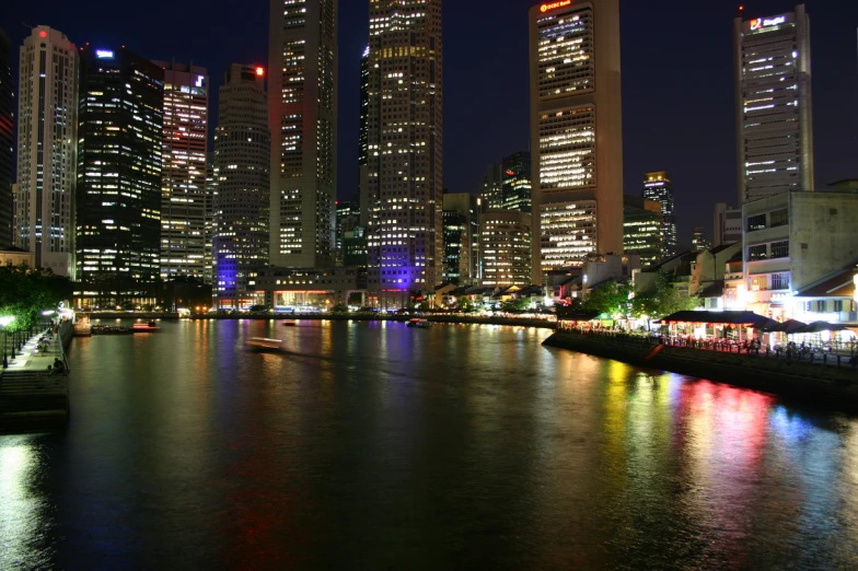 a group of buildings in the distance with water