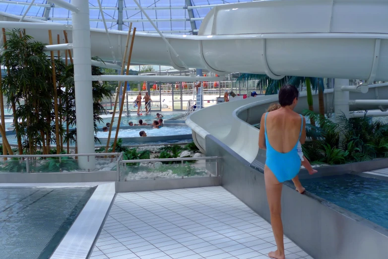 woman watching others swimming in an open waterpark