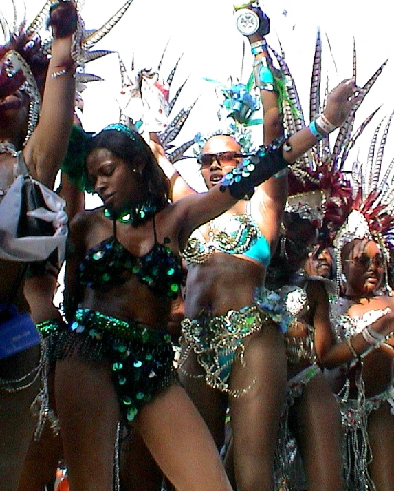 three female dancers at a show in a city