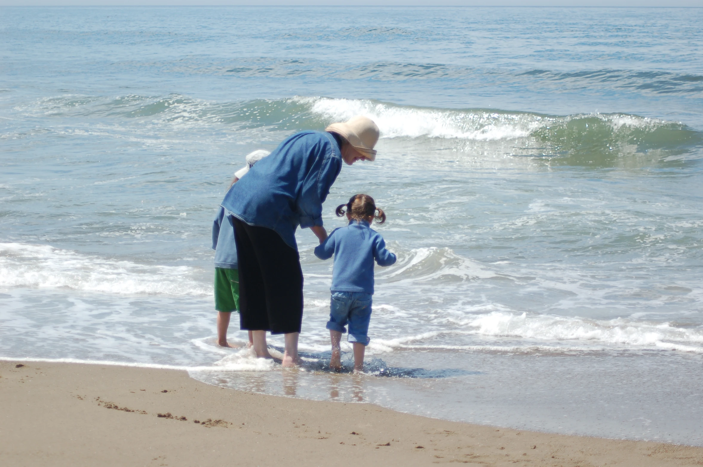 an old man and a  are standing in the water