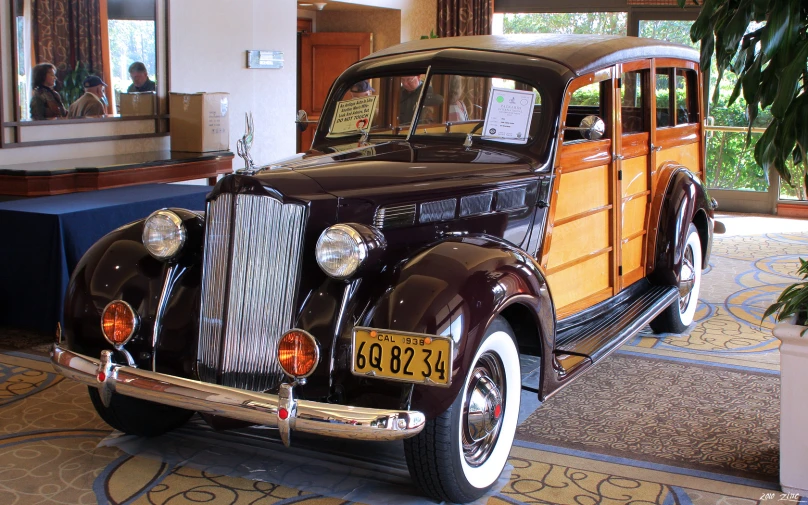 this old car is parked in a room