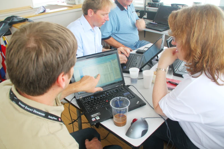 a man and woman working on their laptops